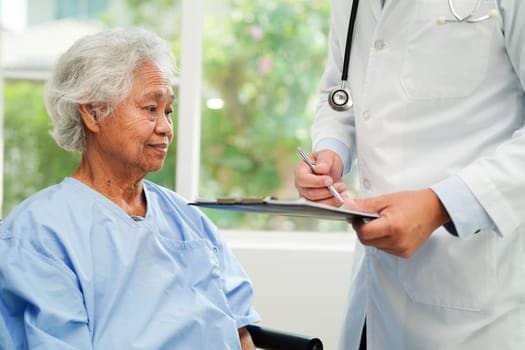 Doctor checking and note diagnosis medicine in clipboard of patients in hospital.
