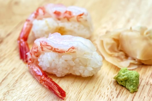 Sashimi sushi on the wood table. Sushi is a type of food preparation originating in Japan.