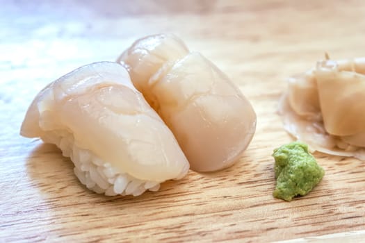 Sashimi sushi on the wood table. Sushi is a type of food preparation originating in Japan.