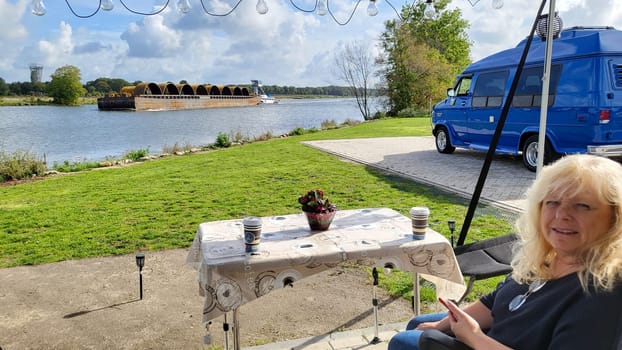 Blitterswijck, The Netherlands - Oktober 02, 2022: Campers parked on a Camer Van pitch. Concept camper van leisure and fun