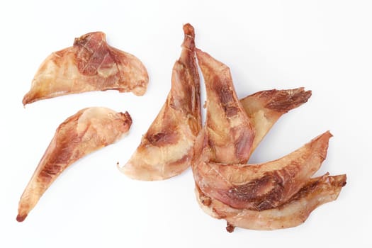 Top view of natural dried treats for dogs. Dried cartilage for dogs isolated on white background