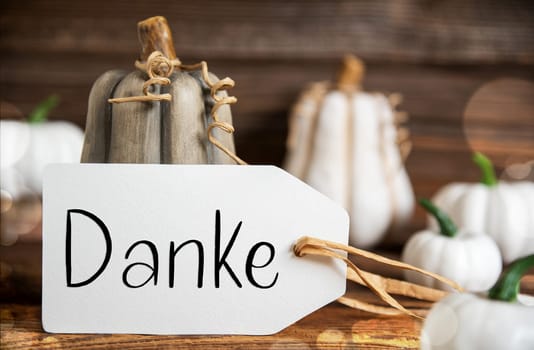 Autumn Decoration With Pumpkins, Rustic fall Decoration With Label With German Text Danke, Which Means Thanks in English