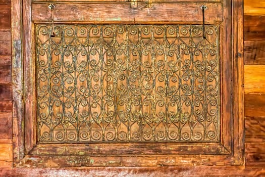 Antique carved wooden windows and wooden wall.