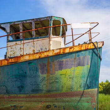 Colorful old rusty fishing boat, abstract prow of old ship hull