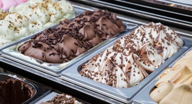 Display counter with assorted ice cream flavours. Selective focus