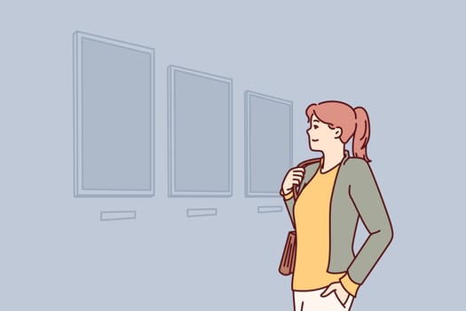 Woman visiting art gallery looks at paintings hanging on wall, painted by classical or contemporary artists. Young girl is in art exhibition hall contemplating work of famous painters.