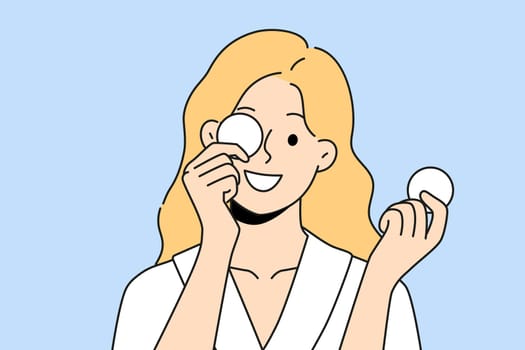 Woman with cotton pads for removing makeup and mascara with lipstick smiling getting ready for bed. Beautiful girl uses cotton pads for cosmetic purposes, wanting to impress boyfriend