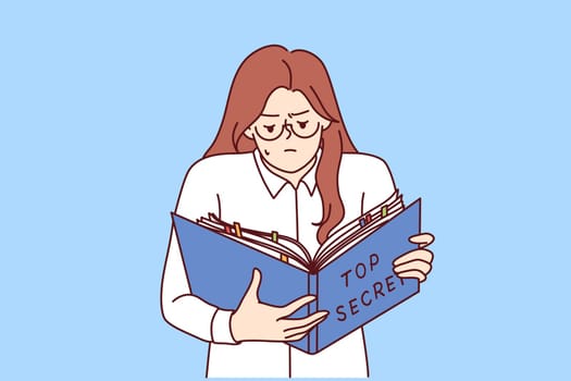 Woman is studying secret documents holding folder of papers in hand and working with confidential data. Businesswoman has access to classified information reads information prohibited for distribution