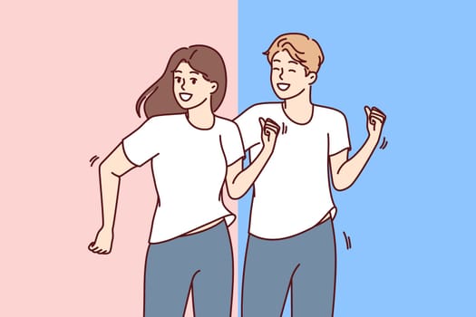 Couple runs and plays sports or fitness together to maintain good health or have strong immunity. Man and woman runs with smile and rejoice at opportunity to lead healthy lifestyle.
