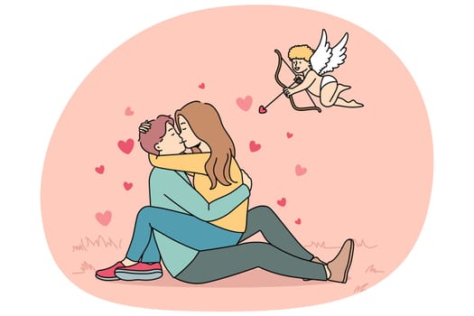 Cupid shooting with arrows in to happy couple kissing. Woman sitting on man hugging and cuddling. Love and relationship. Vector illustration.