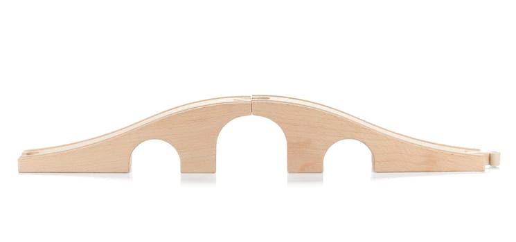 Wooden toy railway bridge. Isolated on white background