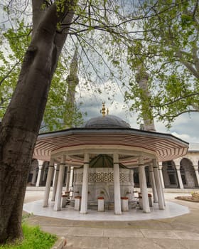 Courtyard of 16th century Atik Valide imperial Ottoman Mosque, with ablution fountain in the front, located in a hill above Uskudar district, in the Asian side of Istanbul, Turkey