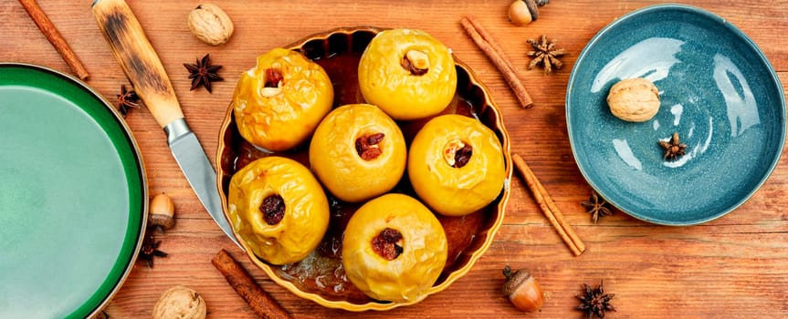 Delicious baked autumn apples with nuts and raisins. Healthy diet.