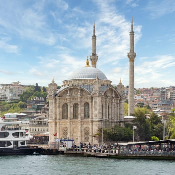 Istanbul, Turkey - May 8, 2023: View from Bosphorus Strait overlooking Ortakoy Mosque, Ortakoy pier square