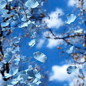 Blue leaves and skies with birds fluttering in a solarization effect (tiled)