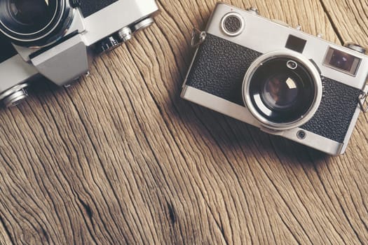 vintage old film camera on wood board with copy space