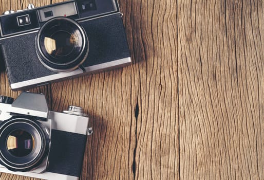vintage old film camera on wood board with copy space