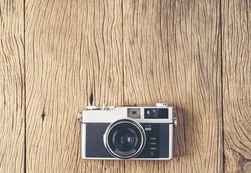 vintage old film camera on wood board with copy space