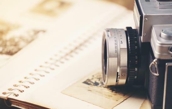 vintage camera on the background of old photos