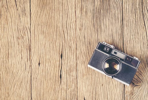 vintage old film camera on wood board with copy space