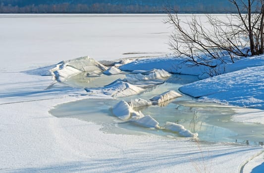 Thawing and Freezing of Pressured Ice Blocks on a River Shore at the Trempealeau National Wildlife Refuge in Wisconsin