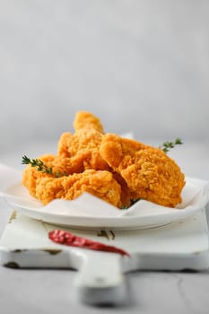 Classic fast food - deep fried spicy chicken meat closeup