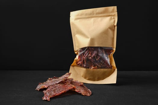Dried beef jerky meat in paper package