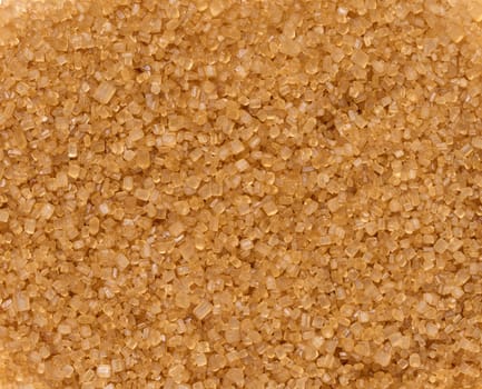 Texture of granulated brown cane sugar, top view