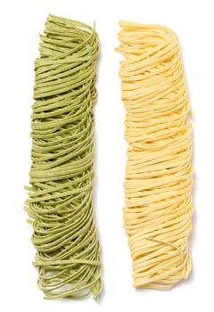 Raw spinach and egg noodles on white background, top view