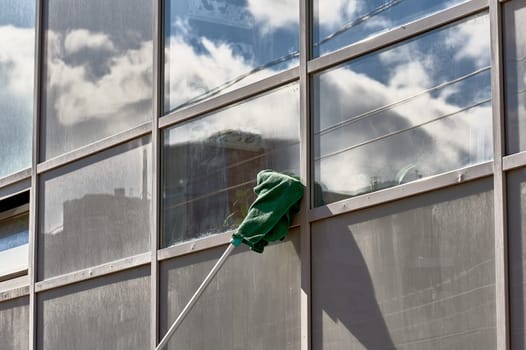 window washing, washing a street shop window. High quality photo