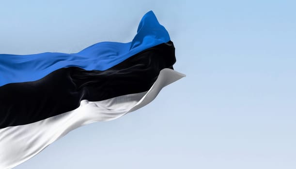 National flag of Estonia waving in the wind n a clear day. horizontal tricolor featuring three equal bands of blue, black and white. 3d illustration render. Fluttering fabric