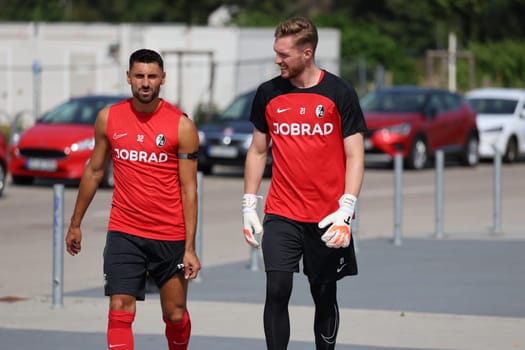 Vincenzo Grifo (SC Freiburg) and goalkeeper Florian Müller (SC Freiburg) on their way to the start of training for Bundesliga club SC Freiburg 2023  DFL REGULATIONS PROHIBIT ANY USE OF PHOTOGRAPHS AS IMAGE SEQUENCES AND/OR QUASI-VIDEONann  Photo: Joachim Hahne/johapress