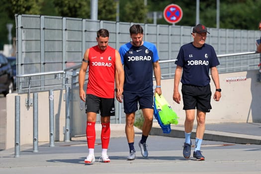 On the way to the first training session at the start of training Bundesliga club SC Freiburg 2023,v.li. Christian Günter (SC Freiburg),assistant coach Florian Bruns (SC Freiburg) and coach Christian Streich (SC Freiburg)  DFL REGULATIONS PROHIBIT ANY USE OF PHOTOGRAPHS AS IMAGE SEQUENCES AND/OR QUASI-VIDEONann  Photo: Joachim Hahne/johapress