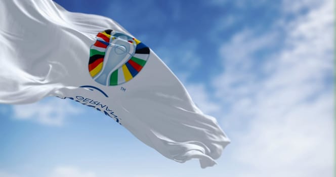Berlin, DE, June 30 2023: UEFA Euro 2024 European Football Championship flag waving on a clear day. International Sport event. Illustrative editorial 3d illustration render