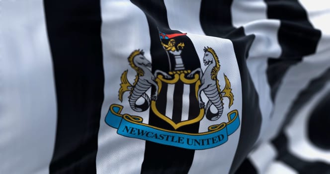 Newcastle, UK, July 2 2023: Fabric background with the Newcastle United flag waving. Illustrative editorial 3d illustration render. Close-up. Textured fabric background. Selective focus