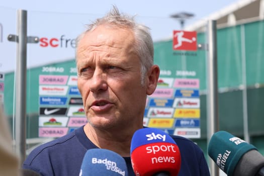 Sought-after interview partner: Coach Christian Streich (SC Freiburg) after the first training session at the start of training for Bundesliga club SC Freiburg 2023  DFL REGULATIONS PROHIBIT ANY USE OF PHOTOGRAPHS AS IMAGE SEQUENCES AND/OR QUASI-VIDEONann  Photo: Joachim Hahne/johapress