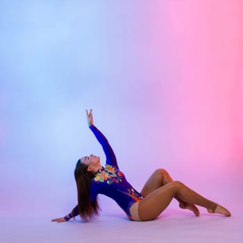 Fashion girl ballet dancer. Sport gymnastics studio shot on a white and black background
