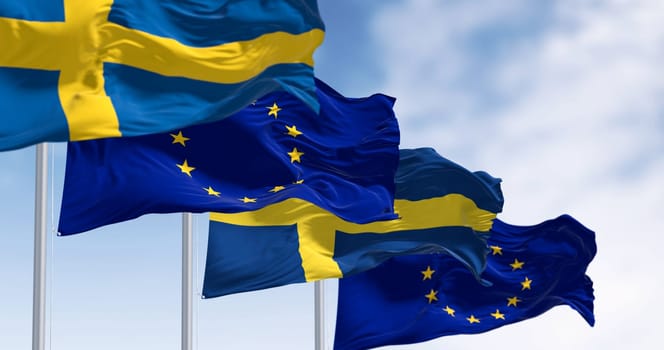 The flags of Sweden and the European Union waving together on a clear day. Sweden became a member of the European Union on January 1, 1995. 3d illustration render. Selective focus. Rippled fabric
