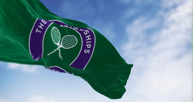London, UK, July 3 2023: The Championships Wimbledon flag waving on a clear day. Wimbledon Championships is a major tennis tournament. Illustrative editorial 3d illustration render.