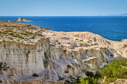 Famous white rocks of Sarakiniko beach, Aegean sea, Milos island , Greece. No people, empty cliffs, summer day sunshine, clear sea, blue waters, beautiful landscape, fantastic rocks of tourist destination.