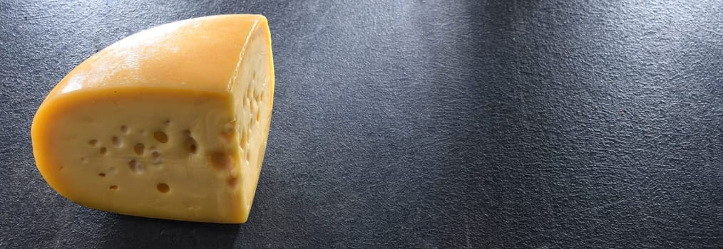 A yellow, medium-hard cheese, classified as a Swiss-type or Alpine cheese