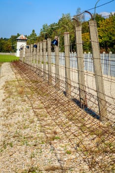 Perimeter fence with electrified barbed wire at Dachau Concentration Camp in Germany