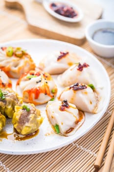 Assortment of steamed dumplings Dim Sum on kitchen table