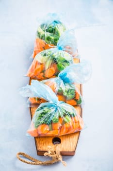 Prepared vegetable bags for freezer. Frozen food, food preservation concept