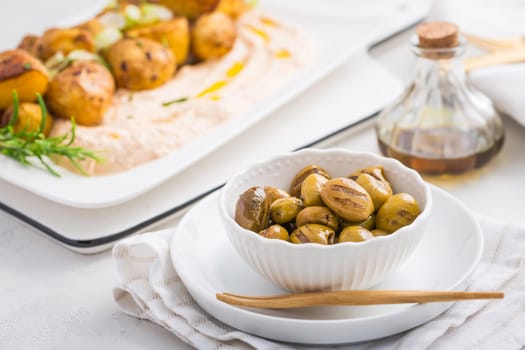 Grilled olives with whipped feta, ricotta, cheese dip (Tirokafteri) with crispy baked potatoes