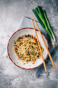 Korean bean sprout salad - spicy mung bean sprouts salad with garlic, sesame seeds, green onions and soy sauce