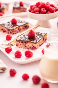 Traditional buttermilk sheet cake with raspberries and chocolate ganache