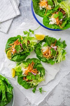 Asian minced meat lettuce wraps with rice, bean sprouts and cabbage
