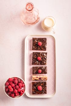 Traditional buttermilk sheet cake with raspberries and chocolate ganache