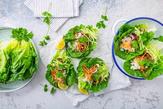 Asian minced meat lettuce wraps with rice, bean sprouts and cabbage